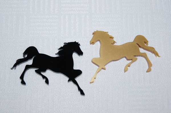 Pferde schwarz gold